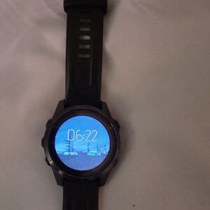 Black Smartwatch with Round Display and Textured Strap